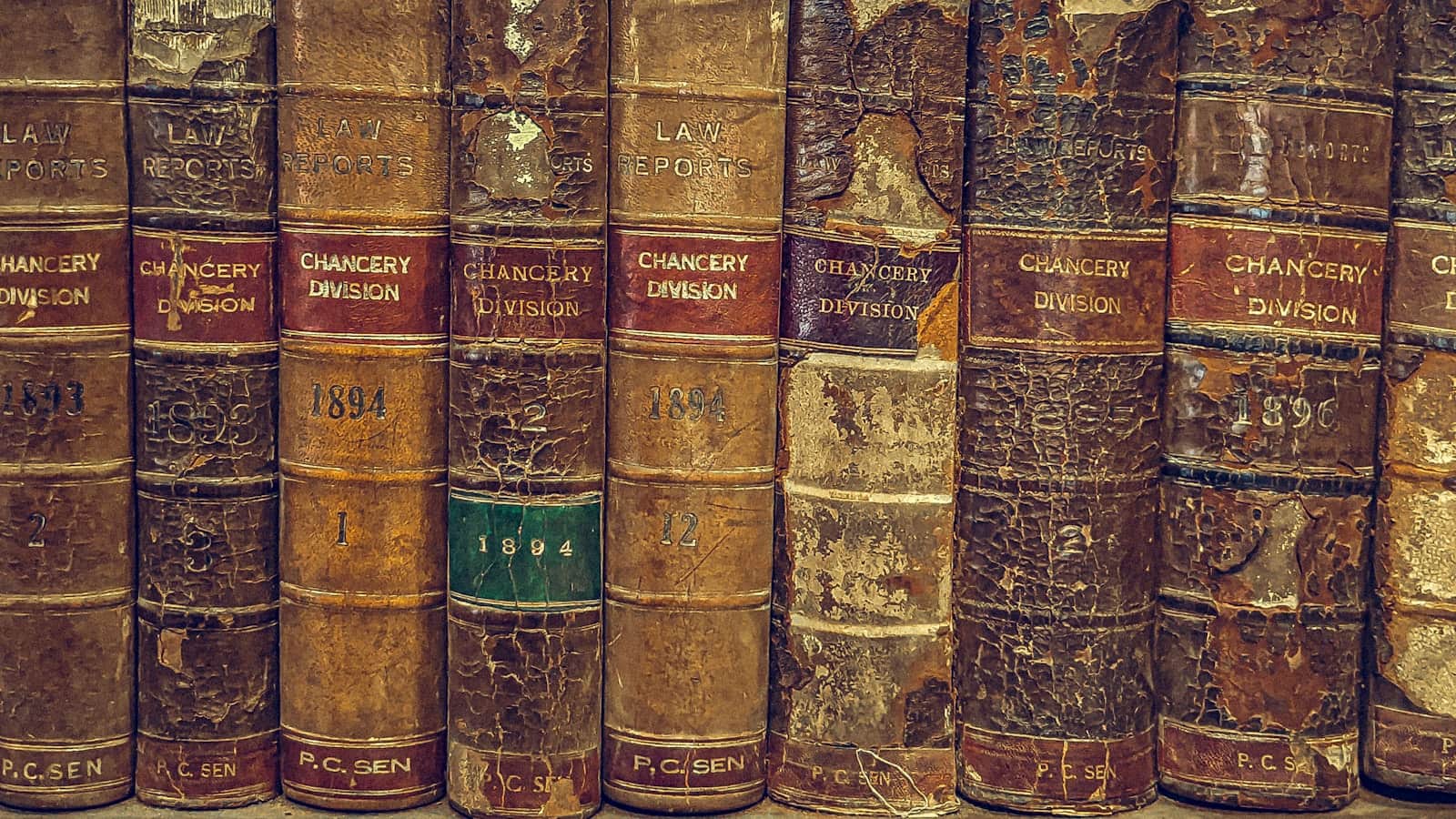 A shelf of leather-bound law reports, their spines worn from decades of use